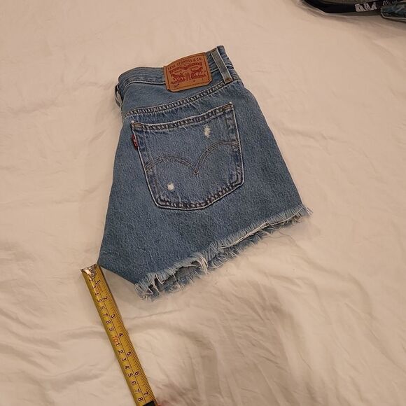 Medium wash distressed button fly, high waist Levi's shorts size 27. - Picture 8 of 9